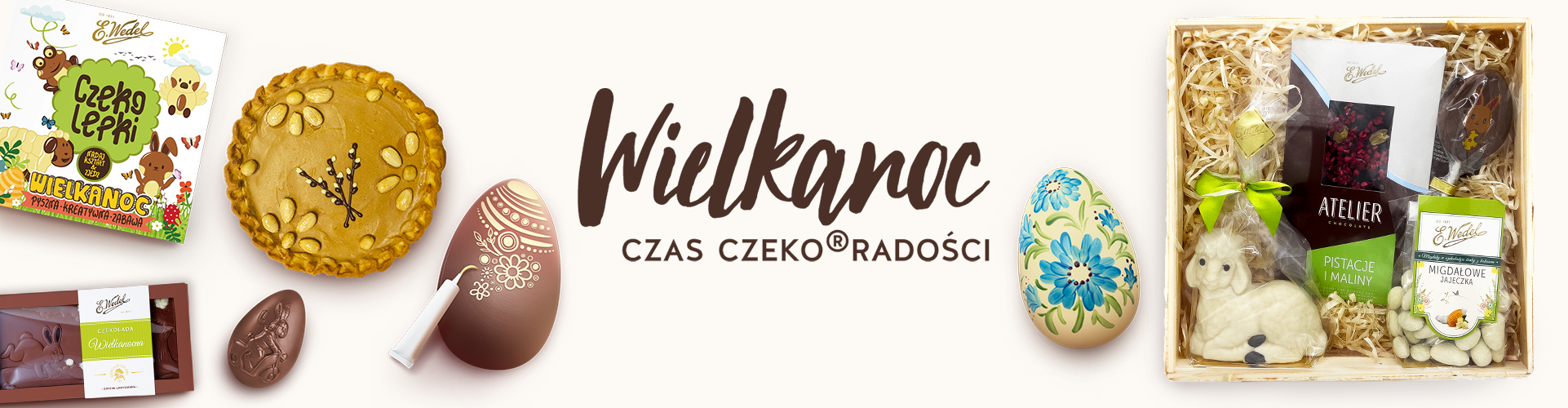 Na obrazku znajdują się produkty wielkanocne- zestaw prezentowy, pisanka ręcznie malowana, mazurek wielkanocny i inne